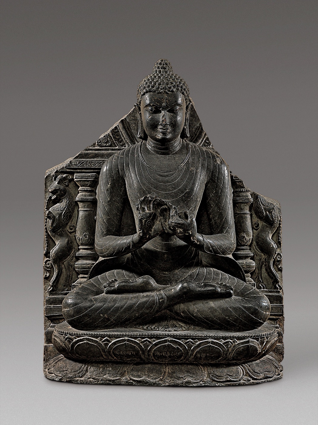 Eleventh-century stone sculpture of the Buddha preaching his first sermon at Sarnath